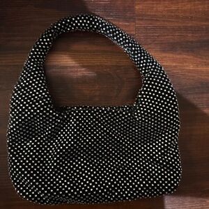 Its a hand bag. Black color. Looks classy!